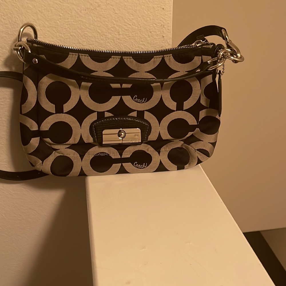 Black and gray crossbody Coach bag
